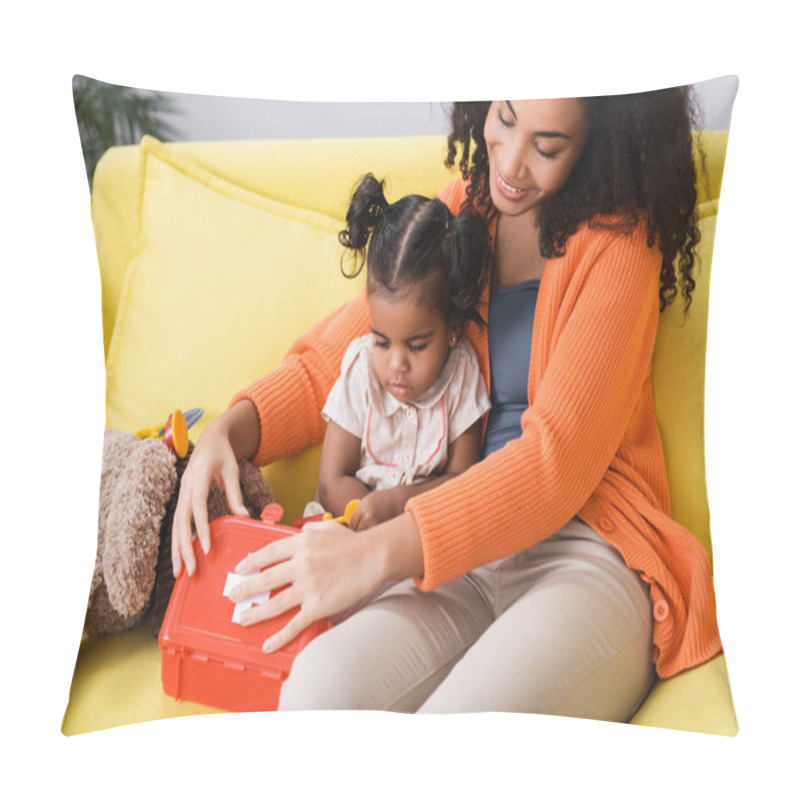 Personality  Happy African American Mother Sitting With Toddler Daughter And Holding Toy First Aid Kit In Living Room Pillow Covers