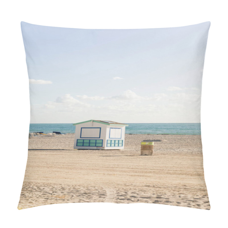 Personality  A Lifeguard Hut Stands Tall On A Sandy Beach Near The Ocean, Offering Protection And Assistance To Beachgoers. Pillow Covers