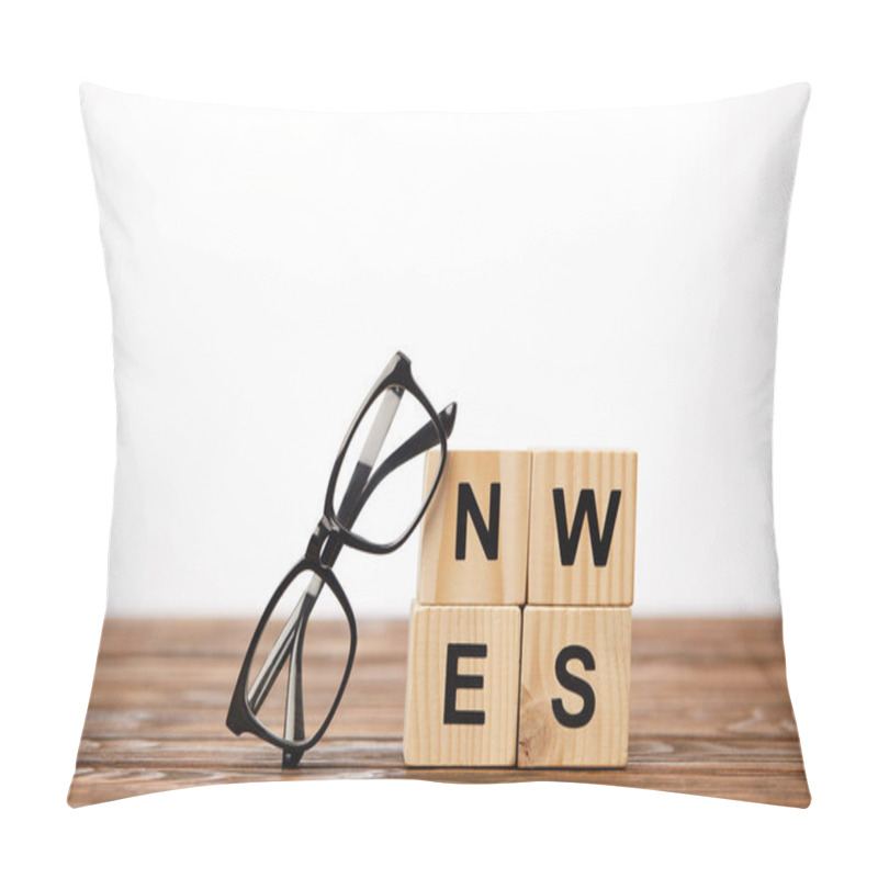 Personality  Eyeglasses And Alphabet Cubes Making Word News On Wooden Surface, On White Background Pillow Covers