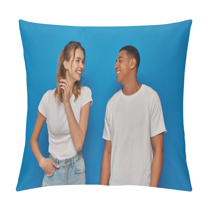 Personality  Cheerful Woman Posing With Hand In Pocket And Looking At African American Friend On Blue Background Pillow Covers