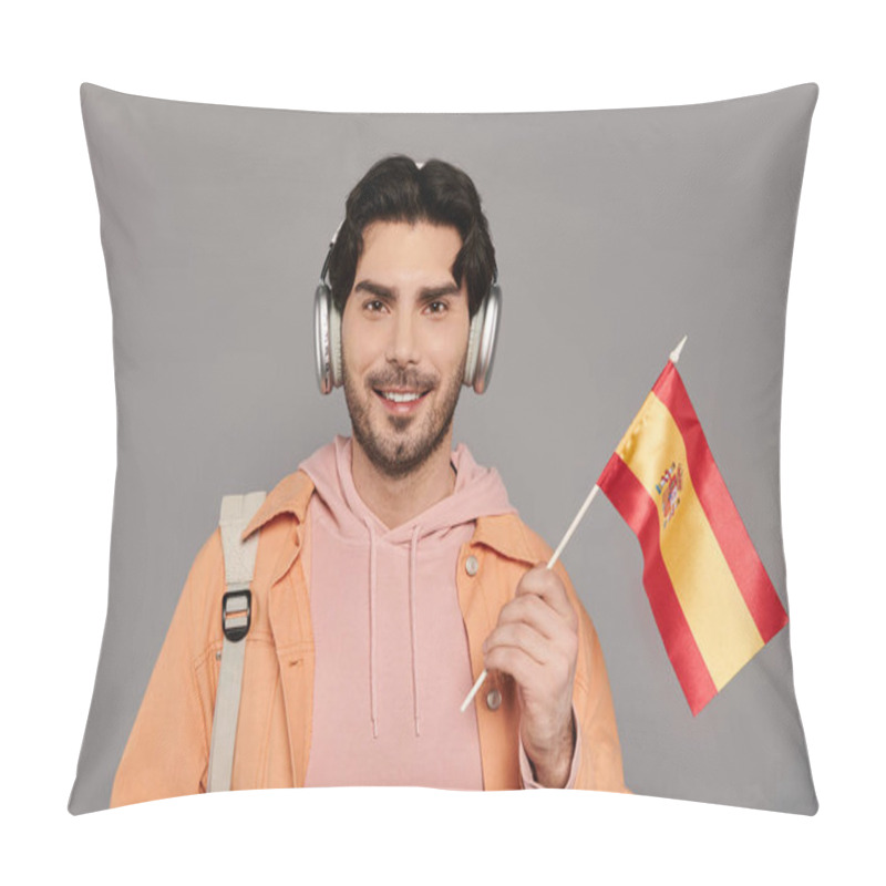 Personality  In A Contemporary Studio, A Young Handsome Man Enjoys Music While Proudly Waving A Spanish Flag. Pillow Covers