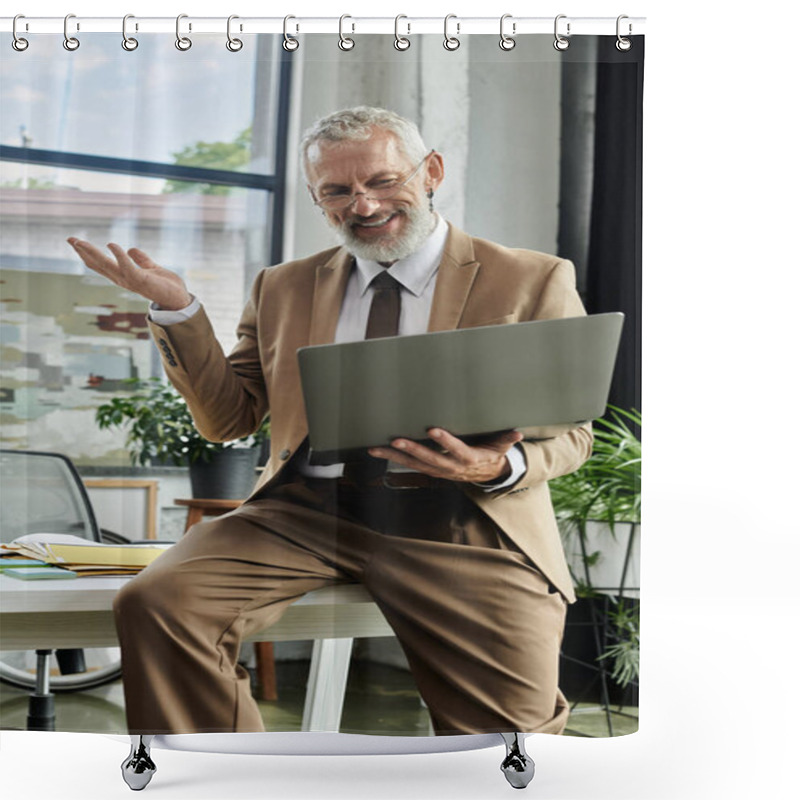 Personality  A Mature Man With A Beard Sits At A Desk, Holding A Laptop While Smiling And Gesturing With His Hand. Shower Curtains