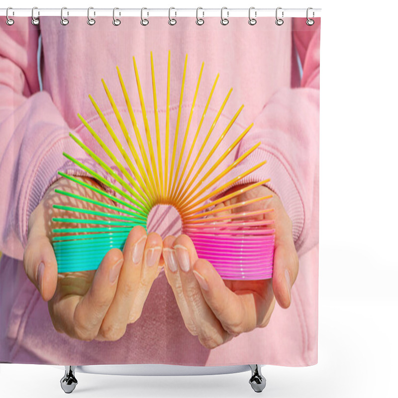 Personality  Toy Plastic Rainbow In Hands On The Background Of A Pink Sweatshirt. Colored Spiral For Games And Tricks Popular In The 90s. Minimalism. The Concept Of Toys, Childhood. Brightness. Shower Curtains