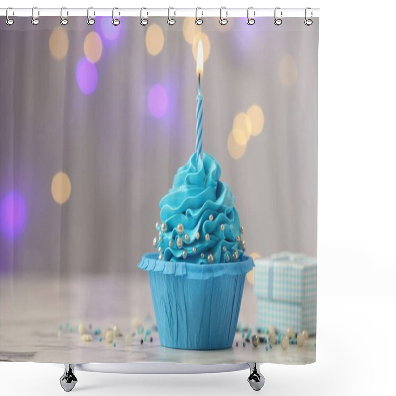 Personality  Birthday Cupcake With Burning Candle And Gift On Light Table Against Blurred Lights. Space For Text Shower Curtains