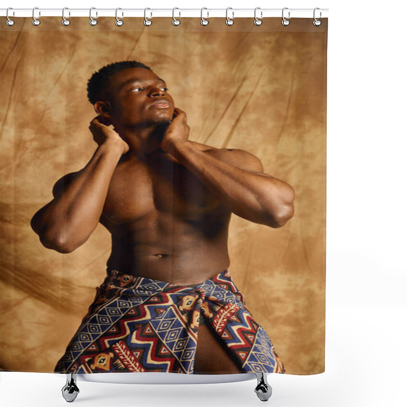 Personality  A Young Handsome African American Man, Showcasing His Physique, Stands Confidently With His Hands On His Neck. He Wears A Traditional Patterned Wrap, Exuding Charm And Charisma In An Artistic Setting. Shower Curtains