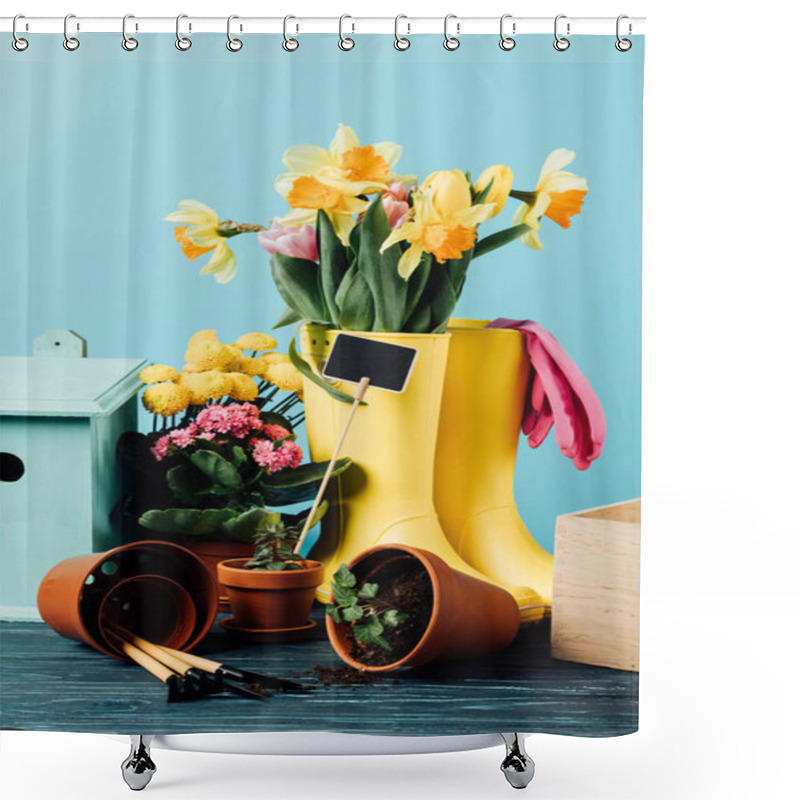 Personality  Close Up View Of Arranged Rubber Boots With Flowers, Flowerpots, Gardening Tools And Birdhouse On Wooden Tabletop On Blue Shower Curtains