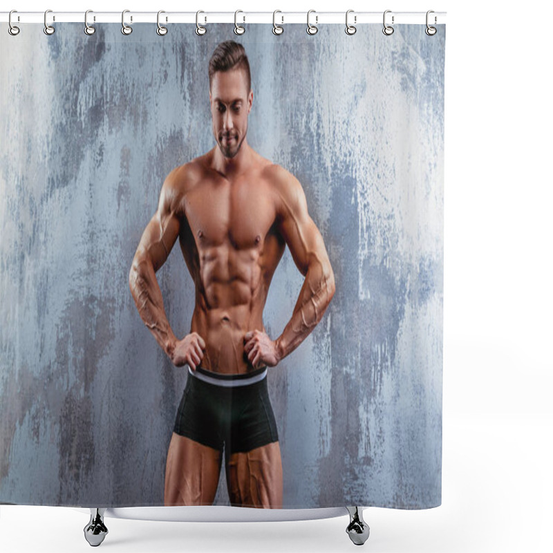 Personality  Portrait Of Strong Healthy Handsome Athletic Man. Fitness Model Posing Near Gray Wall. Fitness Lifestyle Concept Shower Curtains