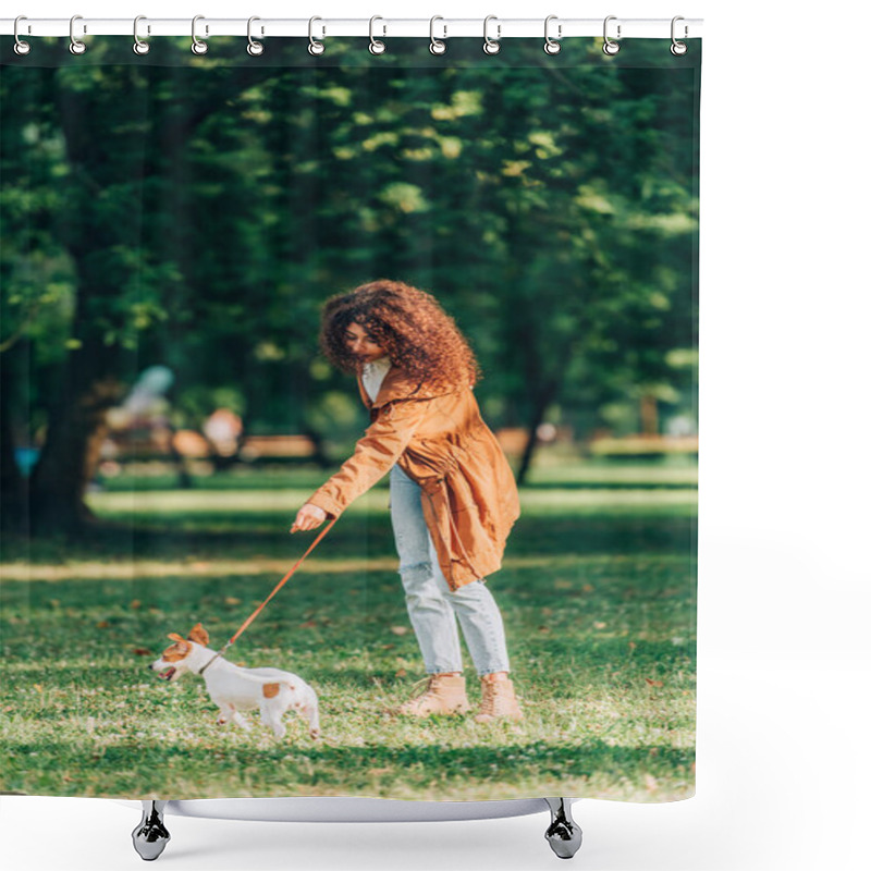 Personality  Selective Focus Of Curly Woman In Raincoat Walking On Leash Jack Russell Terrier On Meadow In Park  Shower Curtains