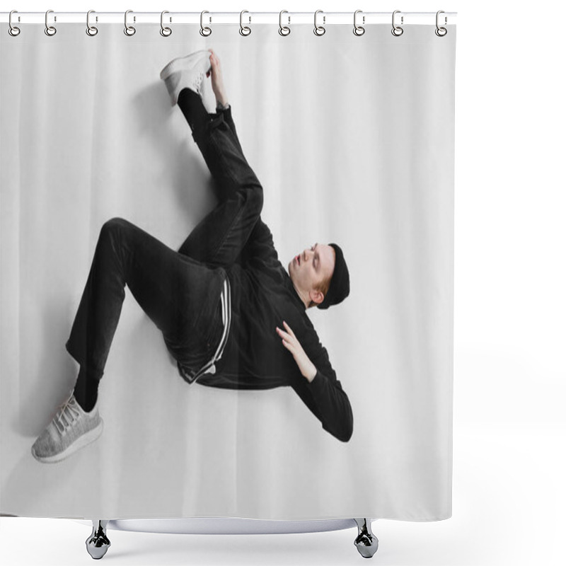 Personality  Freestyle Dancer Dressed In Black Jeans, Sweatshirt, Hat And Gray Sneakers Is Dancing Lying On The Floor In The Studio On The White Background Shower Curtains