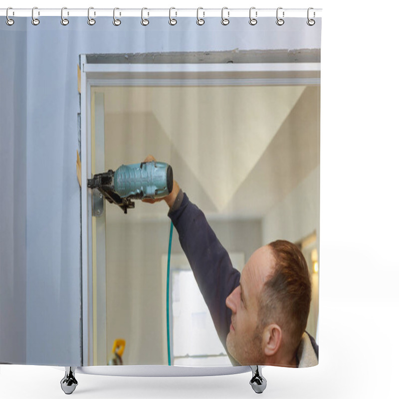 Personality  Construction Handyman Using Air Nail Gun Installing The Interior Door Of Apartment Shower Curtains