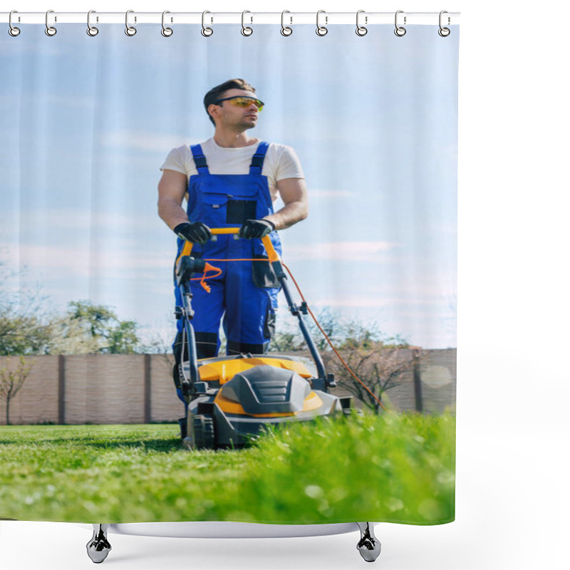 Personality  Young Man Mows The Lawn Using An Electric Lawn Mower In A Special Worker Suit Near A Large Country House In The Backyard Shower Curtains