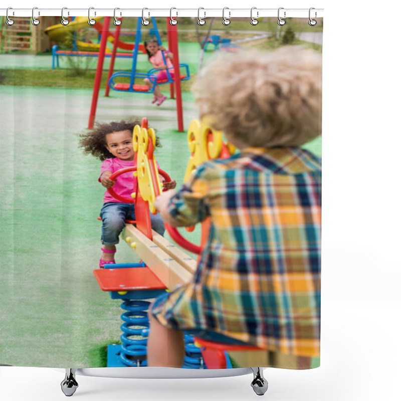 Personality  Rear View Of Boy Riding On Rocking Horse With Smiling African American Little Kid At Playground  Shower Curtains