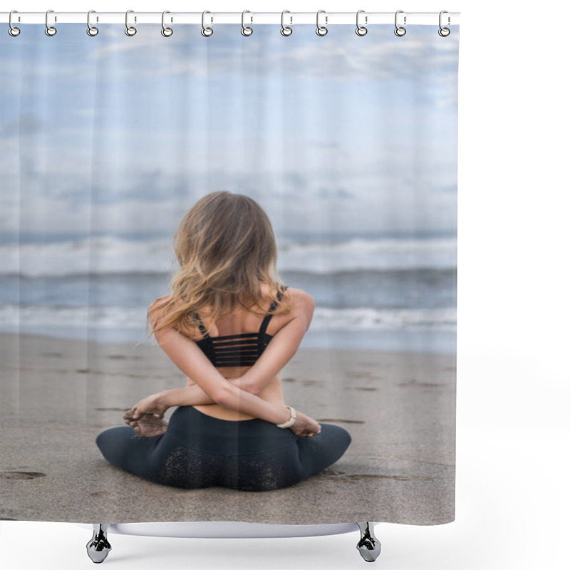 Personality  Rear View Of Young Woman Practicing Yoga In Lotus Pose With Arms Crossed Behind Back On Seashore Shower Curtains