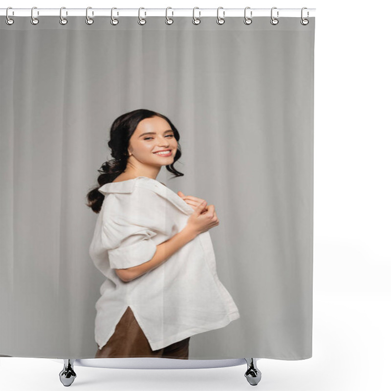 Personality  Cheerful Brunette Woman Looking At Camera While Taking Off White Shirt Isolated On Grey Shower Curtains