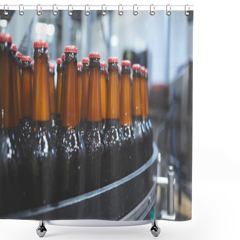 Personality  Beer Bottles On The Conveyor Belt. Shallow Dof. Selective Focus. Shower Curtains