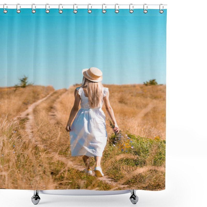 Personality  Back View Of Young Woman In White Dress And Straw Hat Walking In Field With Bouquet Of Wildflowers Shower Curtains