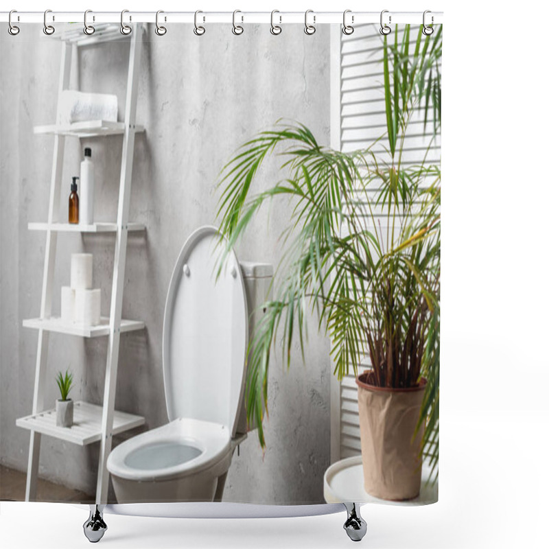 Personality  Interior Of Modern Bathroom With Toilet Bowl Near Rack With Cosmetics, Towels, Toilet Paper, Palm Tree Shower Curtains