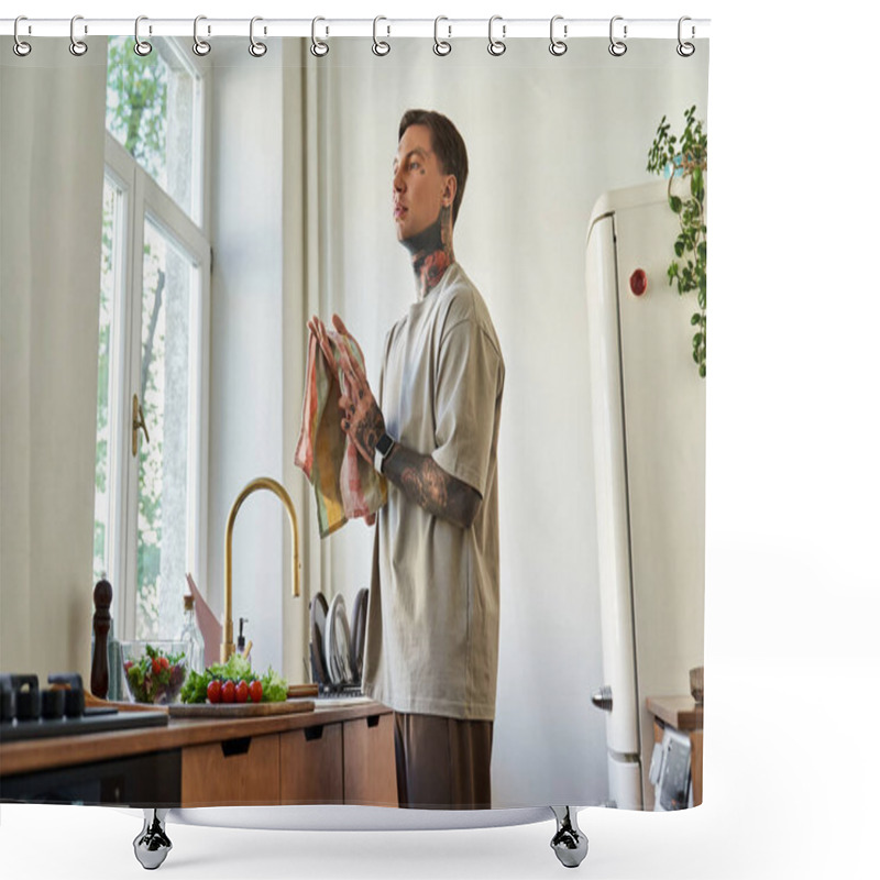 Personality  A Handsome Young Man Wipes Dishes In A Bright Kitchen Surrounded By Plants And Fresh Produce. Shower Curtains