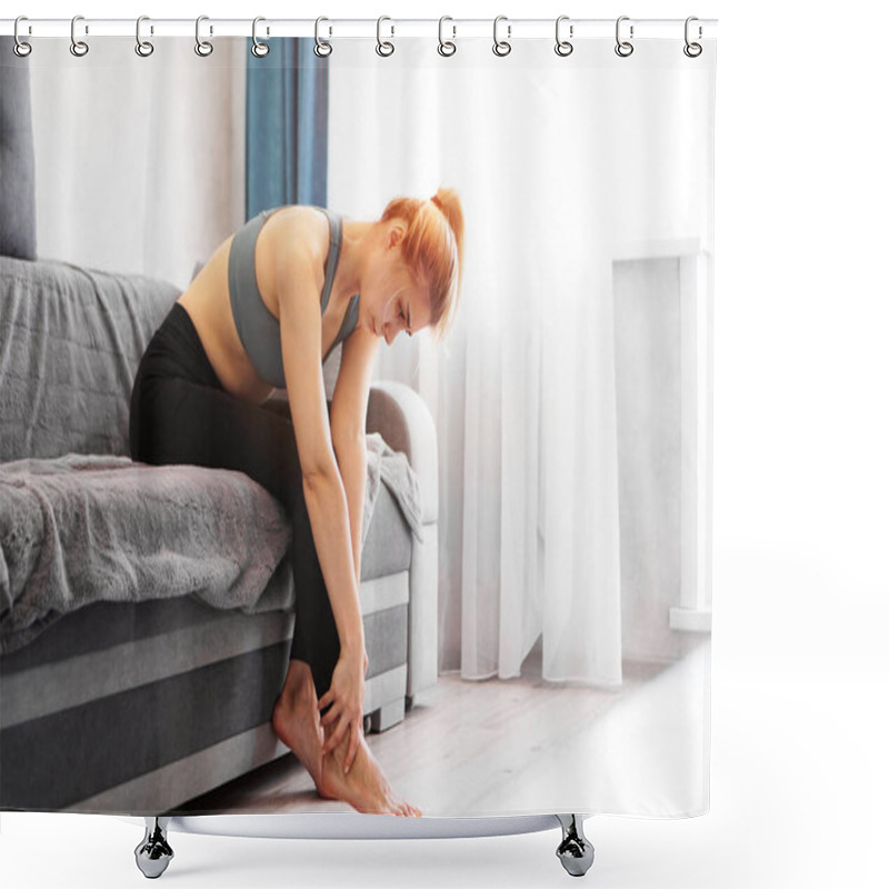 Personality  Woman Sitting On Sofa Holds Her Foot Injury, Feeling Pain. Health Care Concept Shower Curtains