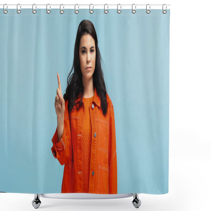 Personality  Skeptical Young Woman In Orange Jacket Pointing Up With Finger Isolated On Blue Shower Curtains