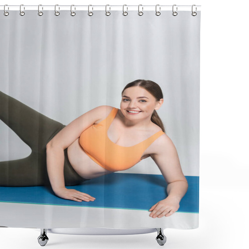 Personality  Strong Woman In Sportswear Performs A Fitness Exercise On A Blue Mat While Smiling. Shower Curtains