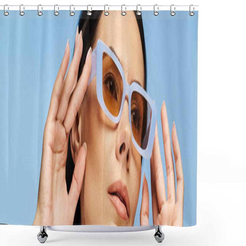 Personality  A Stylish Woman In Sunglasses With Hands On Face, Exuding Coolness On A Blue Studio Backdrop. Shower Curtains