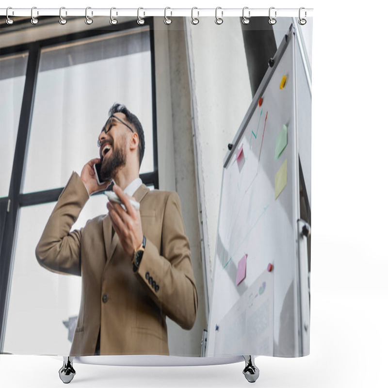 Personality  Low Angle View Of Overjoyed Bearded Businessman In Beige Stylish Blazer Holding Marker And Talking On Smartphone Near Flip Chart With Infographics And Sticky Notes In Office Shower Curtains