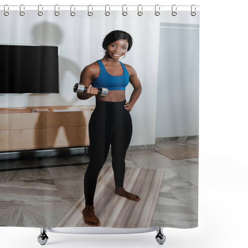 Personality  African American Sportswoman With Hand On Hip Training With Dumbbell On Fitness Mat, Smiling And Looking At Camera In Living Room Shower Curtains