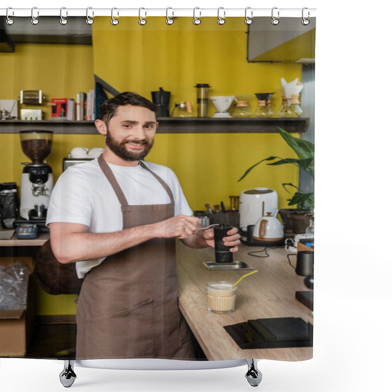 Personality  Cheerful Barista In Apron Grinding Coffee And Looking At Camera Near Cold Coffee Drink In Cafe Shower Curtains