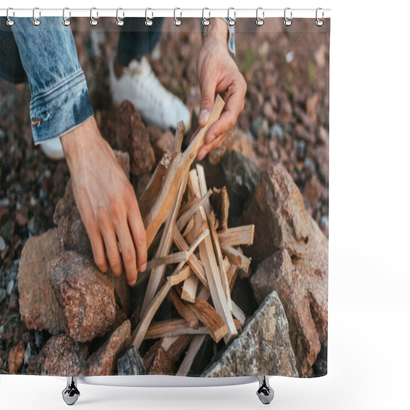 Personality  Cropped View Of Young Man Touching Sticks While Making Bonfire Near Stones  Shower Curtains