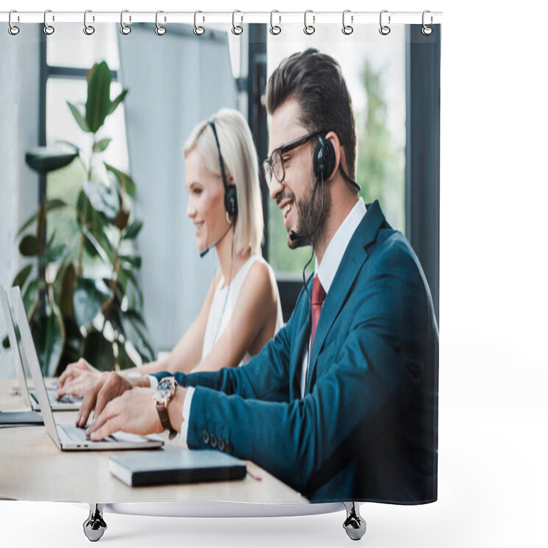 Personality  Selective Focus Of Happy Operator In Headset Typing On Laptop Near Blonde Colleague In Headset  Shower Curtains