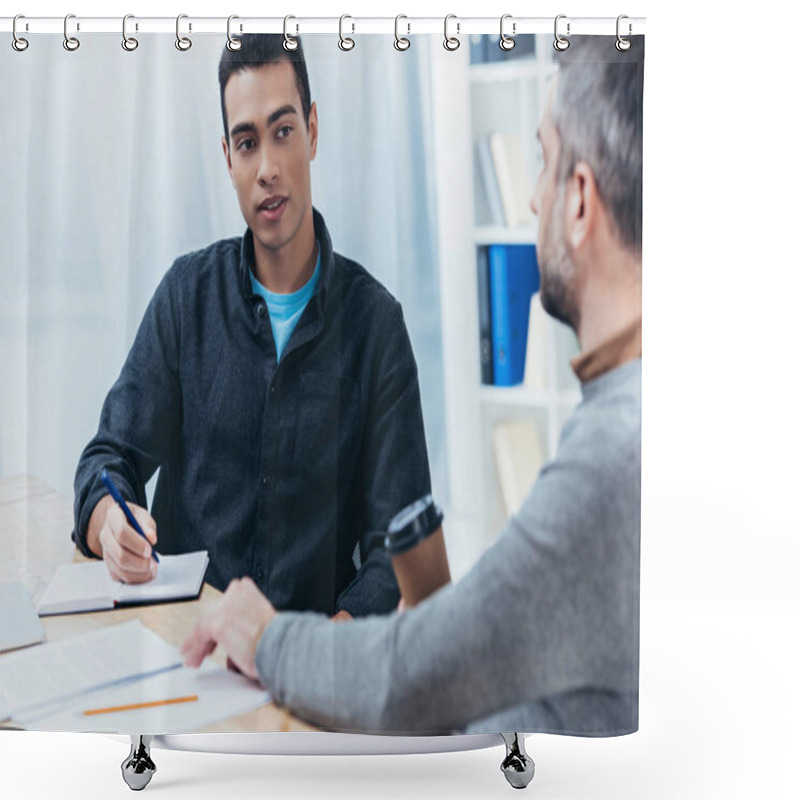 Personality  Young Businessman Writing In Notebook And Looking At Colleague Sitting In Office Shower Curtains