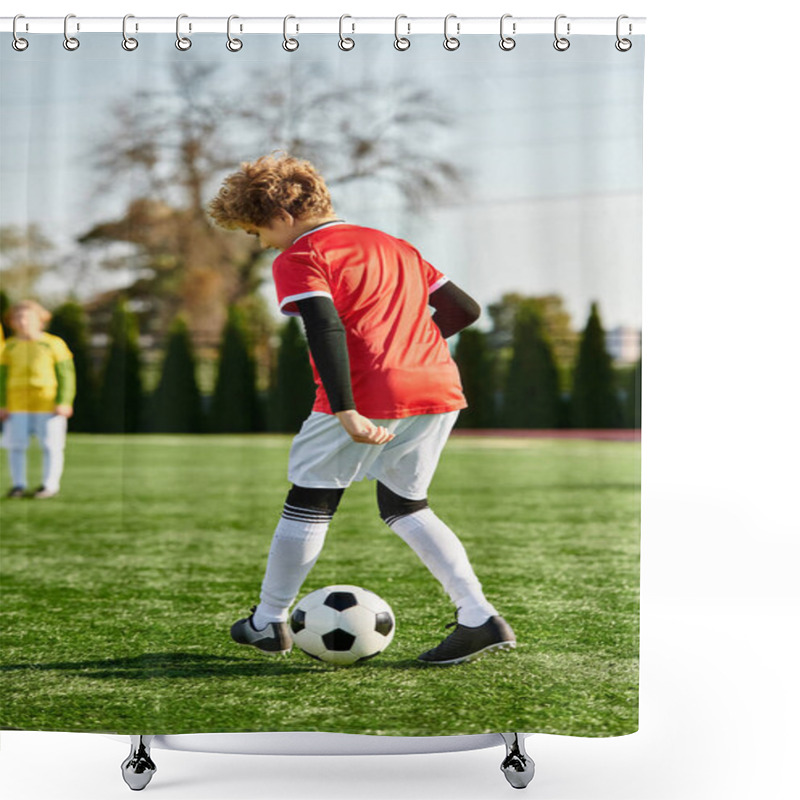 Personality  A Young Boy With A Determined Expression Kicks A Soccer Ball On A Lush Green Field Under The Bright Sun, Displaying His Passion For The Game. Shower Curtains