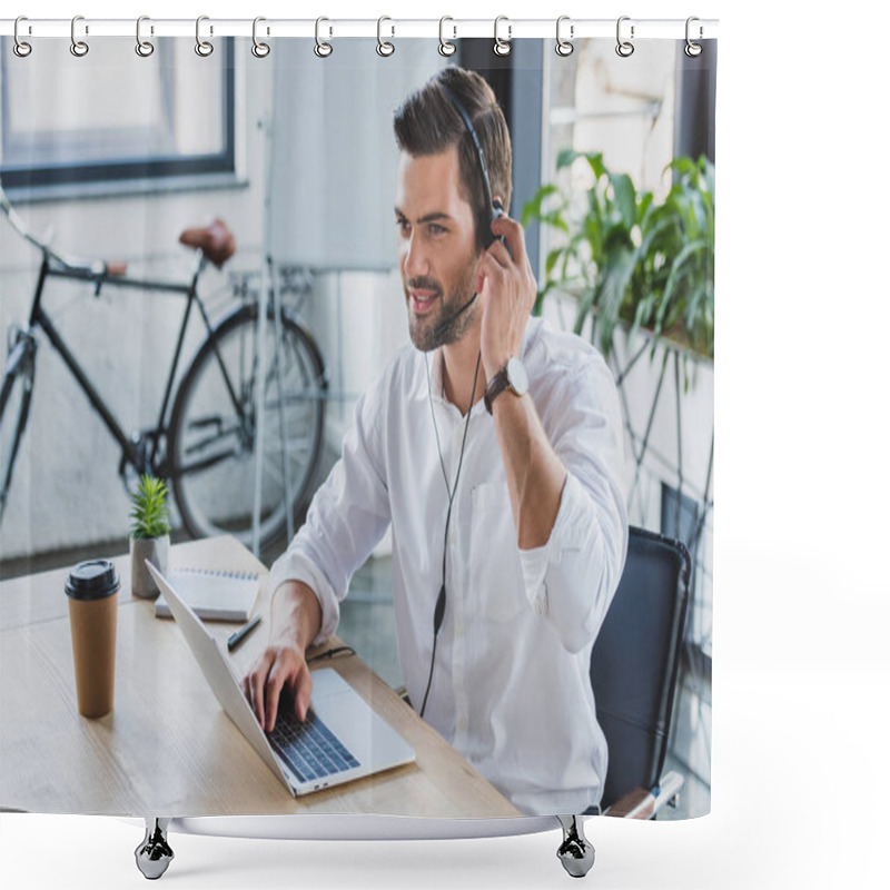 Personality  Handsome Smiling Young Call Center Operator In Headset Using Laptop And Looking Away In Office  Shower Curtains