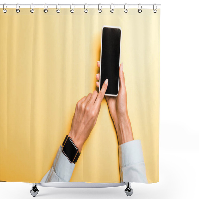 Personality  Cropped View Of Woman Pointing With Finger At Smartphone With Blank Screen On Orange Shower Curtains