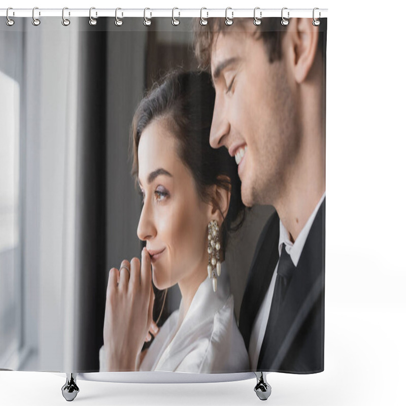 Personality  Joyful Groom In Classic Black Suit Smiling Near Young Bride In Jewelry And White Wedding Dress While Standing Together In Modern Hotel Room During Their Honeymoon, Happy Newlyweds, Hand Near Lips Shower Curtains