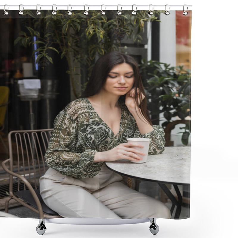 Personality  Young Woman With Long Brunette Hair And Makeup Sitting On Chair Near Round Bistro Table And Looking At Coffee In Paper Cup Near Blurred Plants On Terrace Of Cafe In Istanbul  Shower Curtains