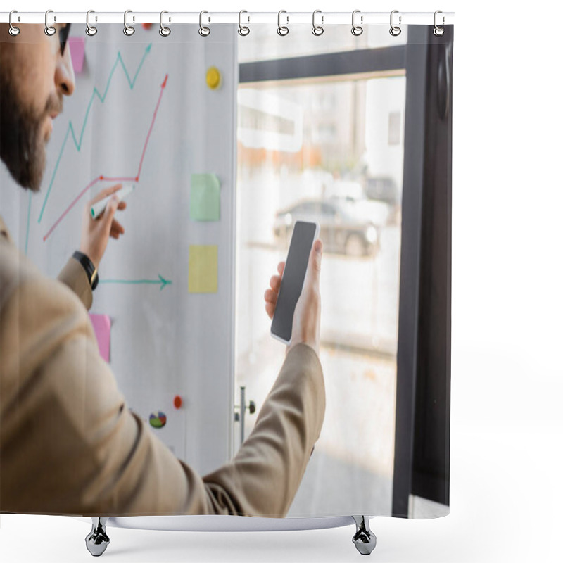 Personality  Cropped View Of Bearded Businessman In Beige Blazer Holding Mobile Phone With Blank Screen And Marker While Drawing Graphs On Flip Chart With Sticky Notes In Office Shower Curtains