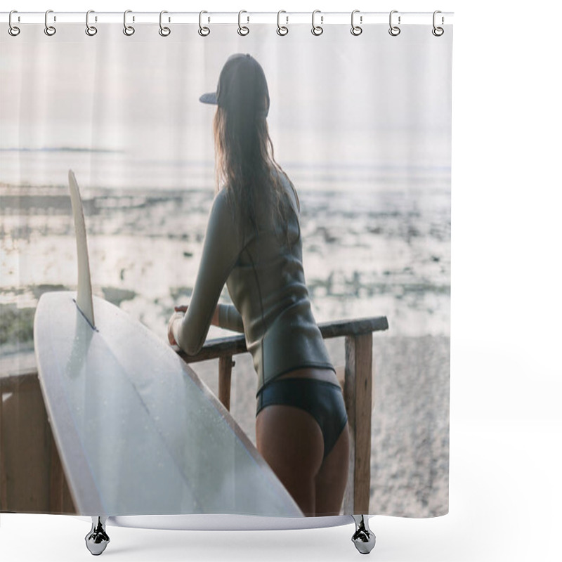 Personality  Rear View Of Attractive Young Woman In Wetsuit And With Surfboard Looking At Sunset Over Ocean Shower Curtains