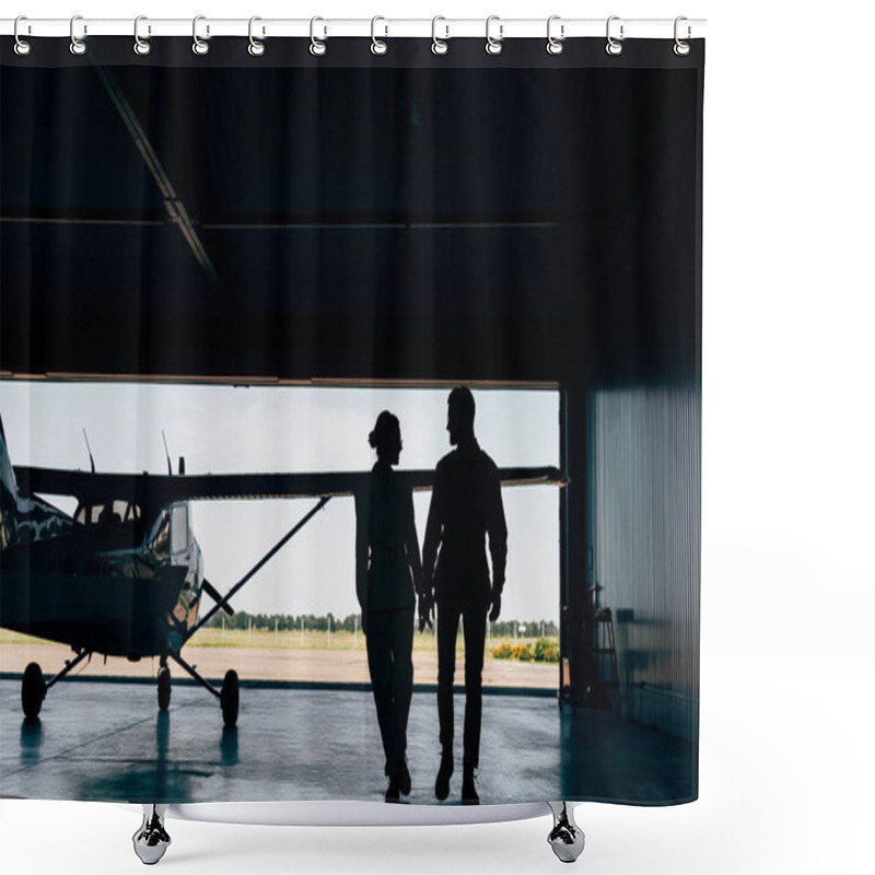 Personality  Rear View Of Silhouettes Of Young Couple Walking Near Airplane In Hangar  Shower Curtains