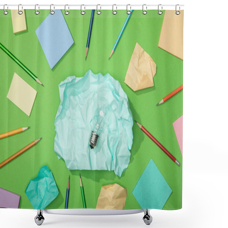 Personality  Top View Of Light Bulb On Big Piece Of Crumpled Paper Near Scattered Paper And Pencils On Green Shower Curtains