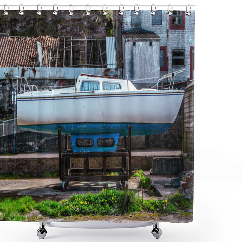 Personality  An Old Yacht Sits On It's Cradle Out Of Water In Front Of Some Old Abandoned Buildings In Pennan, Aberdeenshire, Scotland On A Bright Sunny Day. Shower Curtains