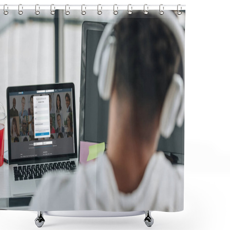 Personality  KYIV, UKRAINE - JULY 29, 2019: Back View Of African American Programmer In Headphones Sitting Near Laptop With Linkedin Website On Screen Shower Curtains