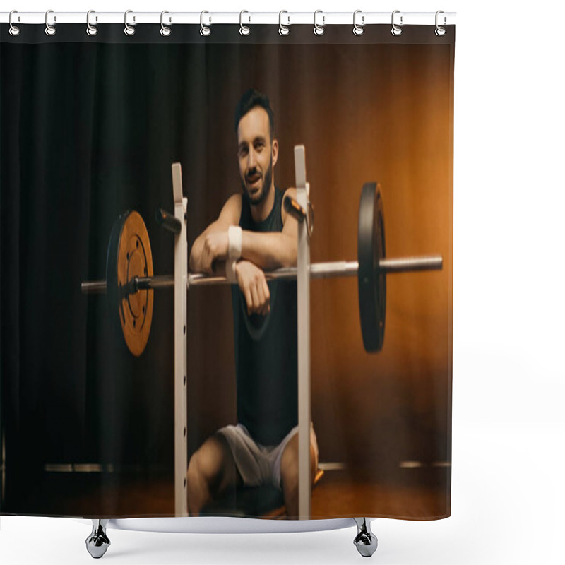 Personality  Smiling Sportsman Looking At Camera Near Barbell On Stand On Dark Background Shower Curtains