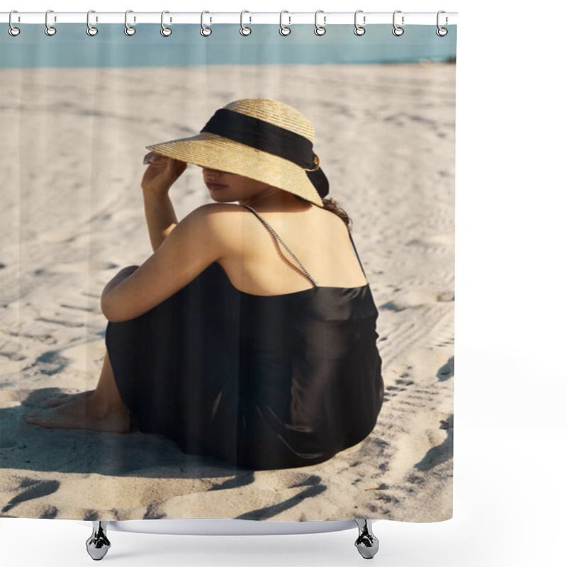 Personality  A Young Woman In A Black Sundress And Straw Hat Sits On The Sand, Her Gaze Lost In The Horizon. Shower Curtains