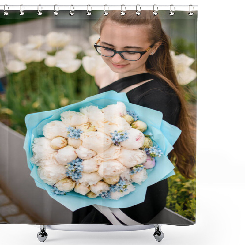 Personality  Attractive Stylish Brunette Girl In Black Suit Holds Bouquet Of White Fragnant Peonies Formed With Blue Packing Paper. Blurred Background. Outdoors. Shower Curtains