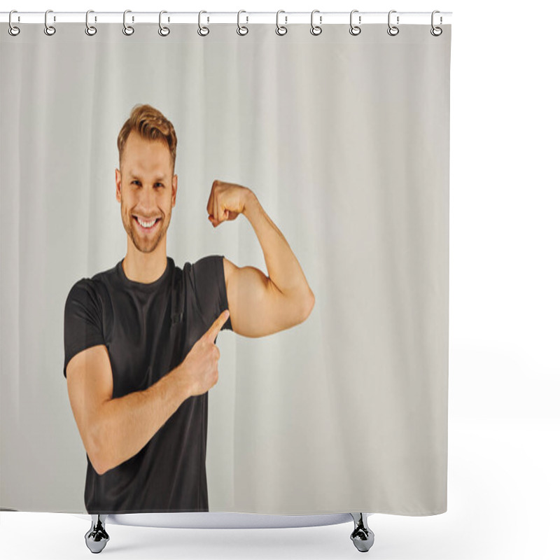 Personality  A Young Athletic Man In Active Wear Flexing His Biceps Against A Gray Background, Showcasing Strength And Determination. Shower Curtains