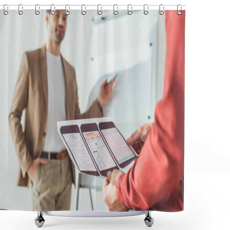 Personality  Selective Focus Of Designer Holding Ux Mobile Application Layout With Colleagues Beside Whiteboard At Background  Shower Curtains