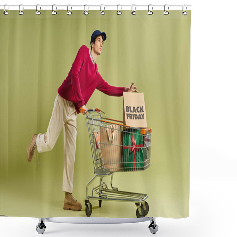 Personality  A Stylish Young Man Holds Shopping Bags And A Cart, Embracing The Excitement Of Black Friday Sales. Shower Curtains