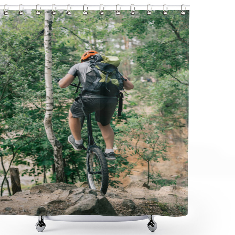 Personality  Back View Of Male Extreme Cyclist In Protective Helmet Balancing On Back Wheel Of Mountain Bike In Forest Shower Curtains